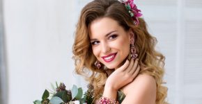 Glamour portrait of beautiful woman model with red lips and long blond hair and Stylish Designer Wedding Flowers